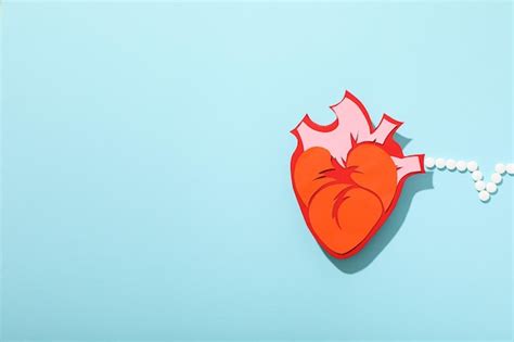 Heart with a cardiogram on a light background | Premium Photo