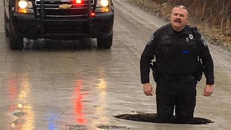 Michigan pothole so large police officer stands knee-deep | FOX 7 Austin