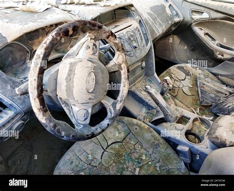 Dirty transport motorized vehicle damaged car interior after flood or ...