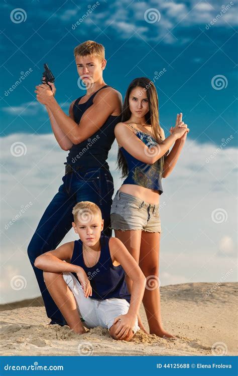 Three Teenagers Sitting At The Beach Royalty-Free Stock Image ...
