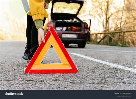 93+ Thousand Unrecognizable Person Putting Down Warning Triangle Road ...