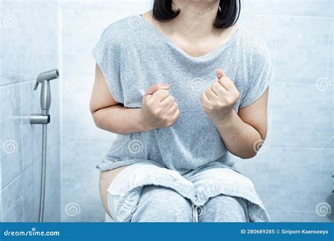 Woman Have Problem with Chronic Constipation, Bowel Movement is Painful Sitting in Toilet Stock ...