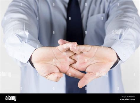 Man cracking the knuckles of his hands and fingers (knuckle-cracking or ...