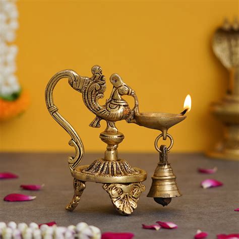 Golden Decorative Handcrafted Peacock Brass Showpiece with Diya Stand ...