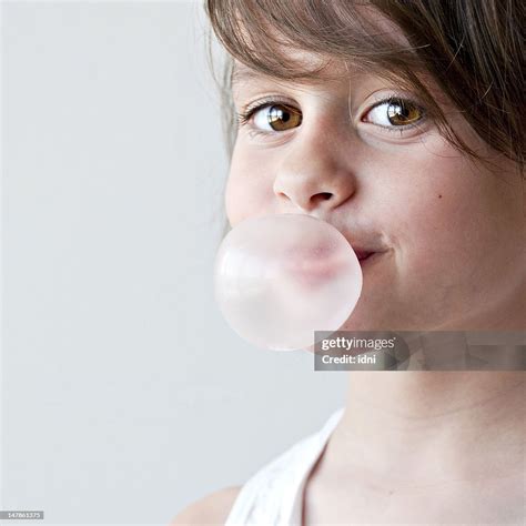 Portrait Of Girl Blowing Bubble Gum High-Res Stock Photo - Getty Images