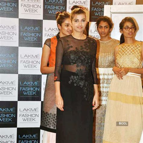 A model enjoys a break during Lakme Fashion Week 2013 fitting sessions ...