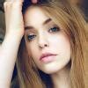 an electron of charge e is revolving in a circular orbit of radius r ...