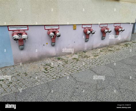 Row of fire department connections (FDCs) on the wall of a building ...