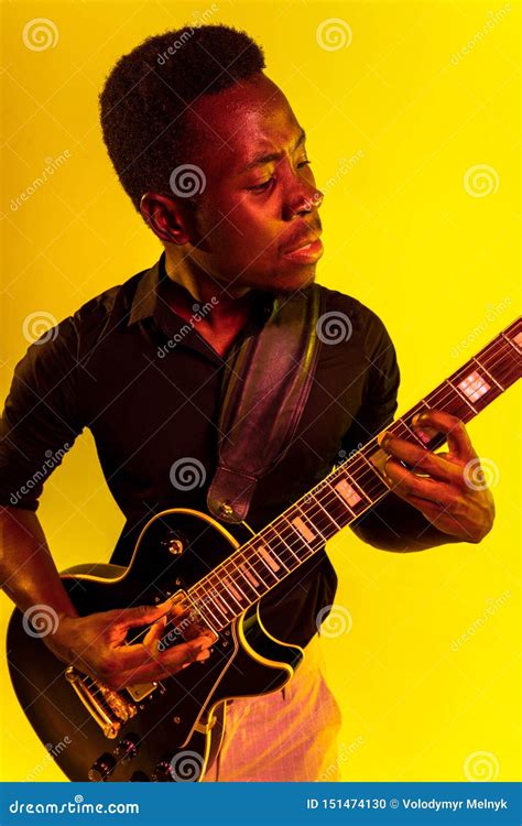 Young African-american Jazz Musician Playing the Guitar Stock Photo ...