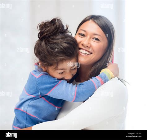 hugging mother and daughter Stock Photo - Alamy