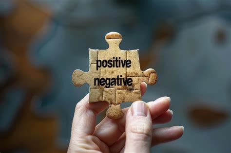 Hand holding puzzle piece with positive and negative spaces | Premium ...