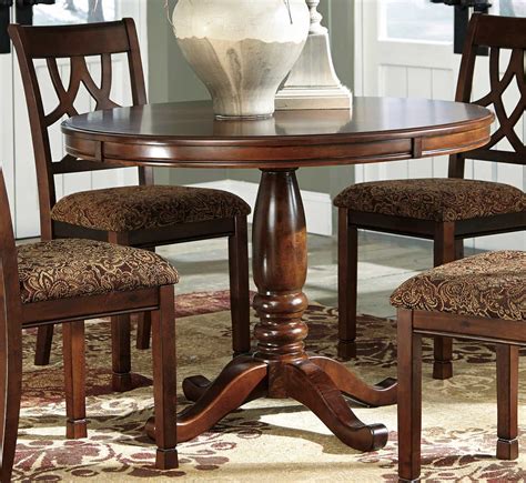 Ashley Furniture Round Dining Table: Stylish & Spacious Solution