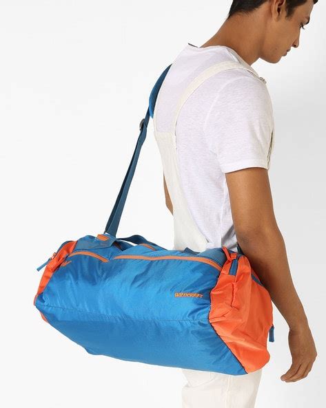 Buy Blue & Orange Wildcraft Gym Duffel Bag with Adjustable Strap | AJIO