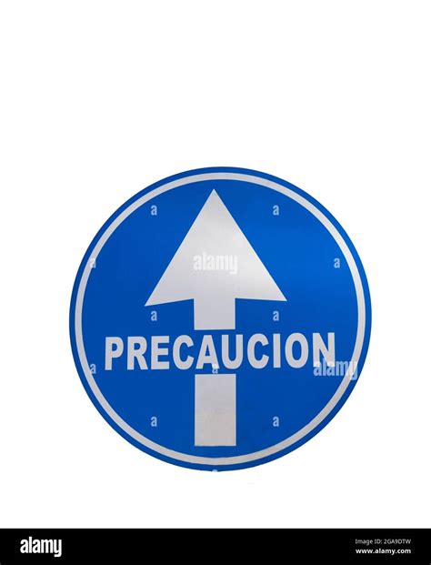round blue sign with an arrow indicating caution in Spanish letters on white background with ...