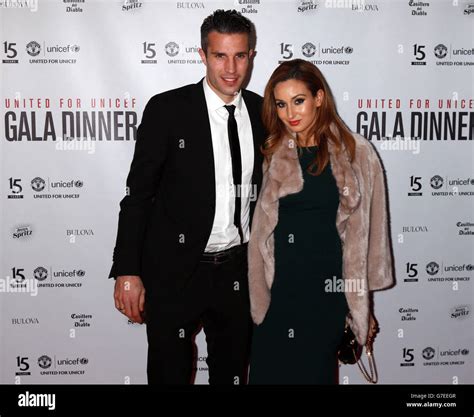 Robin Van Persie and wife Bouchra Van Persie arrive at the United for ...