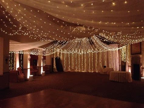 Ceilings and walls covered in drape and twinkle lights make you feel ...