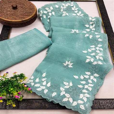 Turquoise Organza Saree Featuring Fine Floral Embroidery