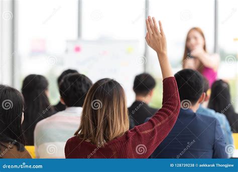 Student Raising Hand Up in a Classroom. Stock Photo - Image of audience ...