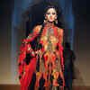 A model flaunts a creation by designers Ashima and Leena on Day 4 of ...