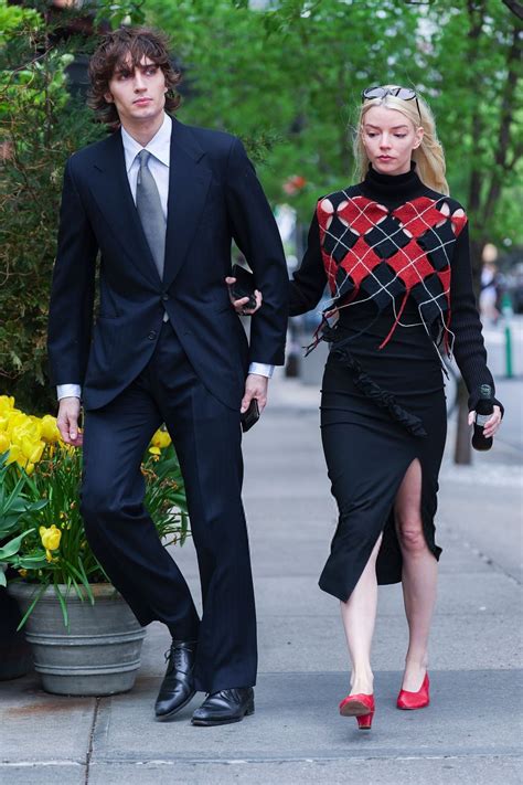Anya Taylor-Joy Stuns in Bold Red and Black Outfit in NYC • CelebMafia