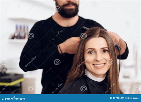 Female Hairdresser Straighten Brown Hair To Pretty Woman Using Hair ...