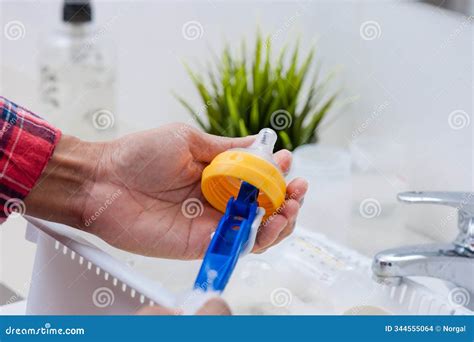 Washing Baby Bottles and Nipples Stock Photo - Image of dishwashing ...