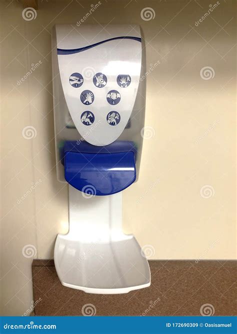 Hand Sanitizer Wall Mounted Dispenser with Liquid Sanitizer at a ...