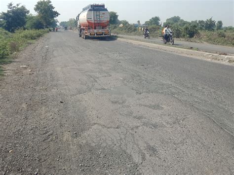 On the road connecting Umreth to Dakor, a kingdom of huge potholes, the ...