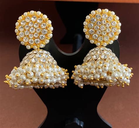 Gold tone precious white stone pearl big jhumkka dj-53222 – dreamjwell