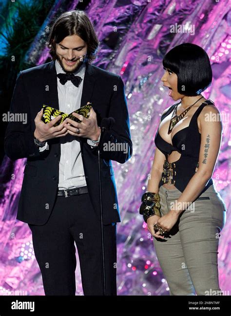 Nicki Minaj, right, and Ashton Kutcher present the award for best ...