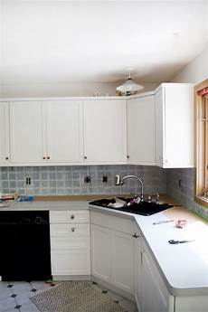 Painting A Tile Backsplash by How To Paint Your Tile Backsplash Brepurposed Painting A Tile Backsplash