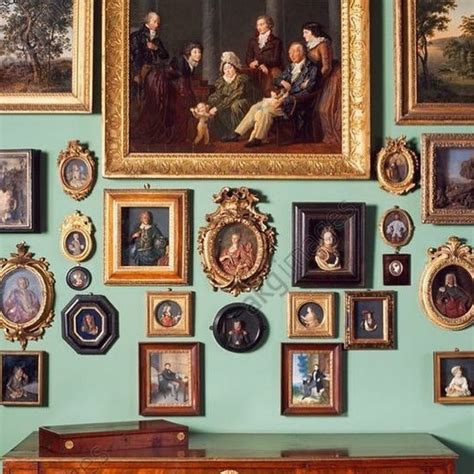A beautiful wall covered with antique portraits | Antique picture ...