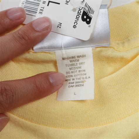 "deadstock" new balance logo t shirt 90s | focus
