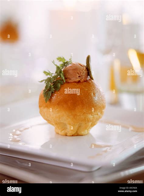 Classic French brioche stuffed with mousse de foie gras accompanied by ...