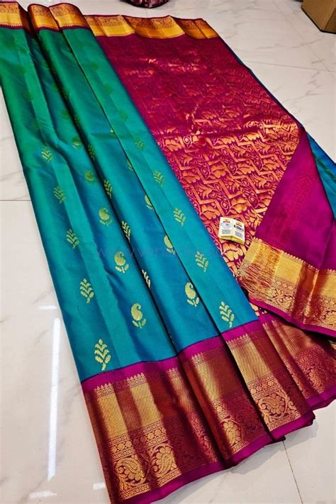 Teal Blue Kanjivaram Silk Saree with Magenta Pallu and Golden Zari Border