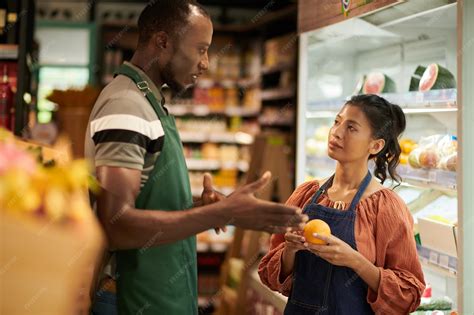 Premium Photo | Supermarket manager talking to employee