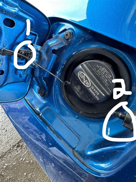 Camry gas tank stopped opening unless I use a card to pry it open ...