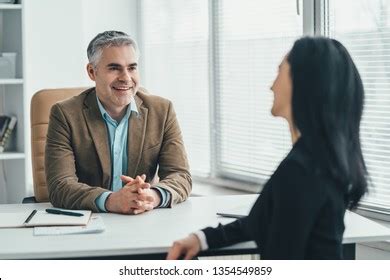 Two Business People Talking 的图像结果