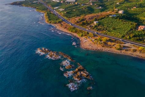 Aerial shots of the turquoise water, reef formations, beach and shipwreck at Henrietta Rocks.