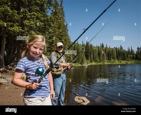 Two girls fishing hi-res stock photography and images - Alamy