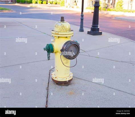 Yellow fire hydrant in the middle of the street, fire crew, city ...