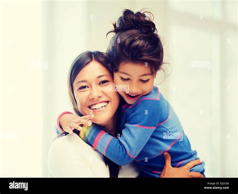 hugging mother and daughter Stock Photo - Alamy
