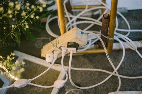 Four-plug electrical outlet with all terminals in use. 46349387 Stock ...