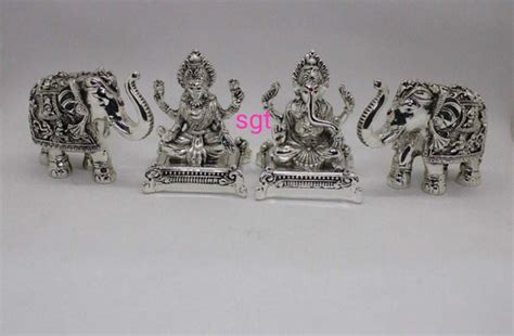 ANTIQUE FINISH GERMAN SILVER GANESHA AND LAKSHMI IDOL WITH ELEPHANTS ...
