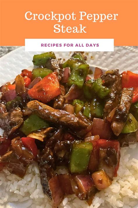 A bowl of slow cooker pepper steak, served over white rice