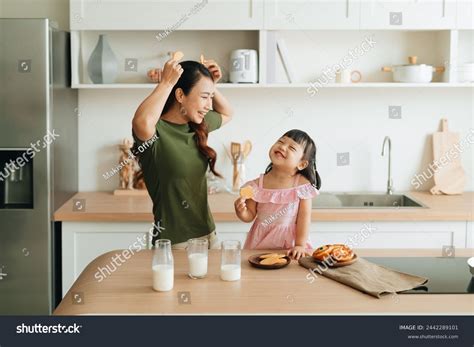 Cheerful Mom Daughter Drinking Milk Holding Stock Photo 2442289101 ...