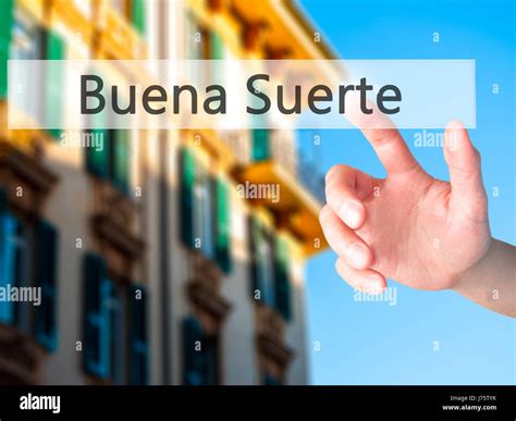Buena Suerte ( Good Luck in Spanish) - Hand pressing a button on ...