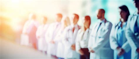 Group of medical doctors over hospital background health care | Premium ...