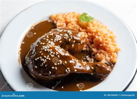 Mexican Chicken with Mole Sauce and Red Rice Stock Image - Image of ...