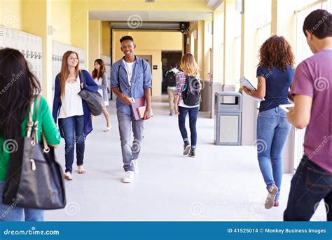 Group Of High School Students Walking Along Hallway Stock Photo - Image ...